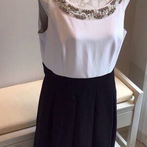 Elegant Cream and black dress with beautiful beading at neck